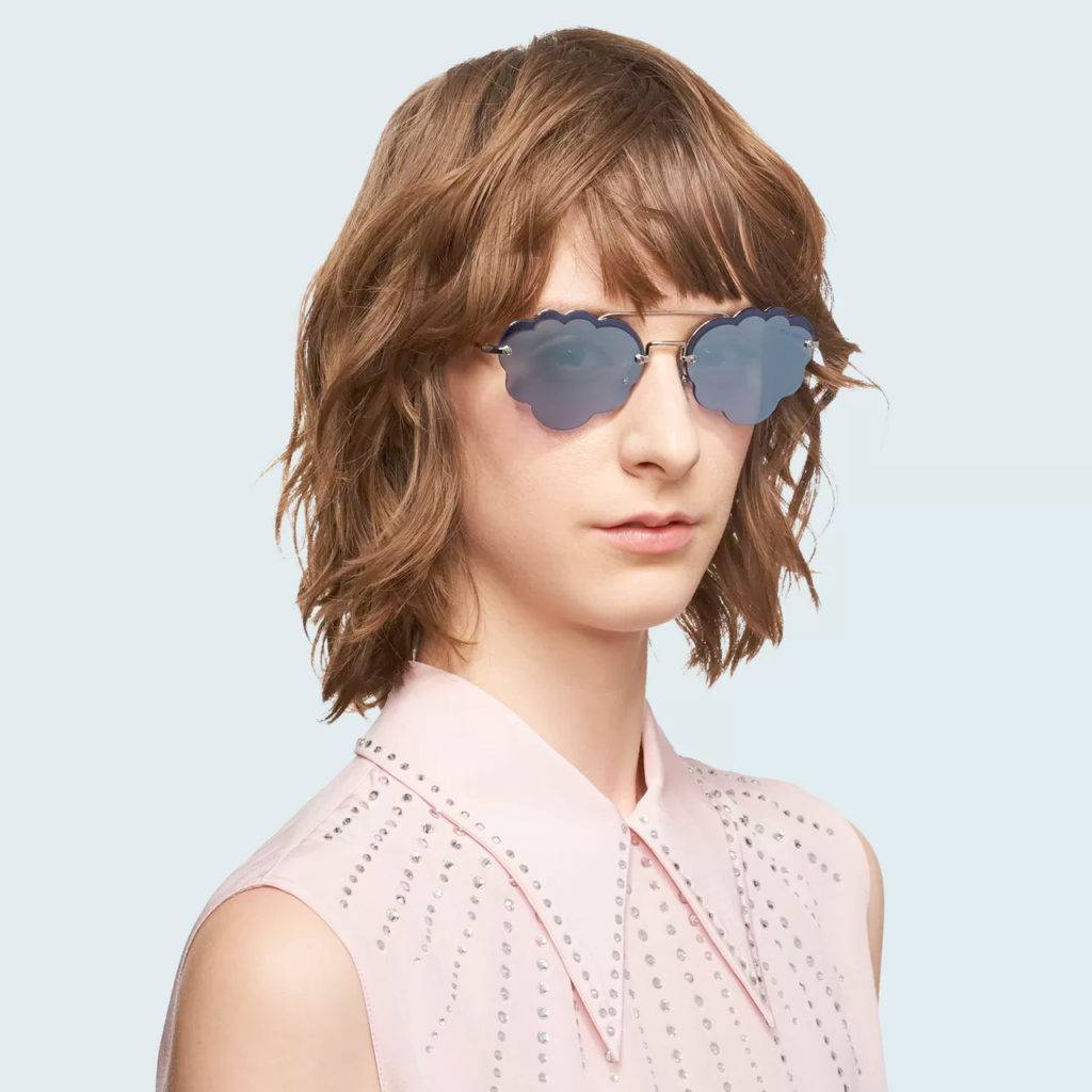 woman wearing designer sunglasses