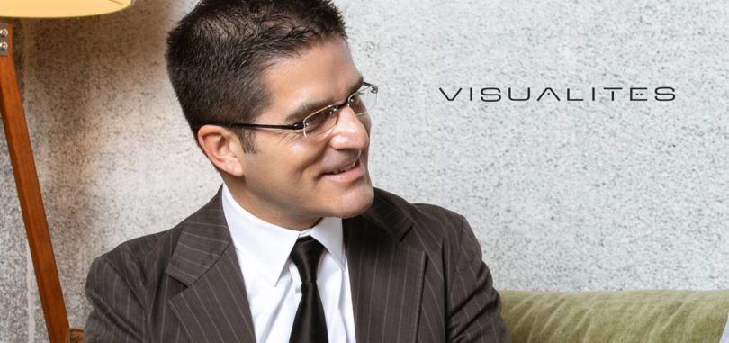 man wearing rimless reading glasses
