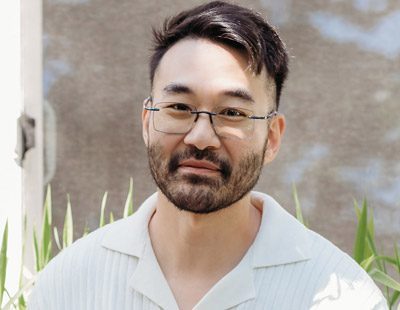 Man Wearing Designer Rimless Reading Glasses