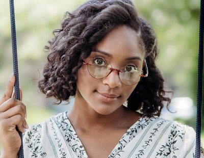 Woman Wearing Visualites Amour Lightweight Rimless Reading Glasses In Red