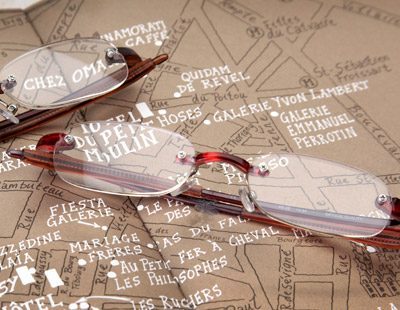 Visualites 5 Designer Rimless Reading Glasses Sitting On A Map